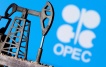 FILE PHOTO: A 3D printed oil pump jack is seen in front of displayed OPEC logo in this illustration picture, April 14, 2020. REUTERS/Dado Ruvic