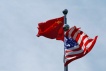 FILE PHOTO: Chinese and U.S. flags flutter near The Bund, before U.S. trade delegation meet their Chinese counterparts for talks in Shanghai, China July 30, 2019.  REUTERS/Aly Song