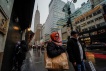 People carry shopping bags during the holiday season in New York City, U.S., December 15, 2022. REUTERS/Eduardo Munoz