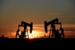 FILE PHOTO: Pump jacks operate at sunset in an oil field in Midland, Texas U.S. August 22, 2018. REUTERS/Nick Oxford/