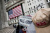 FILE PHOTO: A Wall Street plate is seen on a street vendor stall outside the New York Stock Exchange in New York City, U.S., July 11, 2025. REUTERS/Jeenah Moon/File Photo
