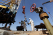Specialists work at a drilling rig at the Airankol oil field operated by Caspiy Neft in the Atyrau region, Kazakhstan, April 20, 2026. REUTERS/Pavel Mikheyev