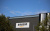 FILE PHOTO: Amazon logo outside an Amazon warehouse in Manchester, Britain, October 28, 2025. REUTERS/Phil Noble/File Photo