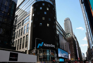 FILE PHOTO: The Nasdaq logo is displayed on a screen at the Nasdaq Market site in Times Square in New York City, U.S., April 17, 2026. REUTERS/Brendan McDermid/File Photo