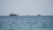 Vessels near the Strait of Hormuz, as seen from Musandam, Oman, August 6, 2026. REUTERS/Stringer