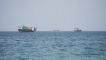 FILE PHOTO: Vessels near the Strait of Hormuz, as seen from Musandam, Oman, August 6, 2026. REUTERS/Stringer/File Photo