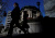 FILE PHOTO: Pedestrians walk past the Bank of Japan building in Tokyo, Japan March 18, 2024. REUTERS/Kim Kyung-Hoon/File Photo
