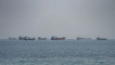 Vessels near the Strait of Hormuz, as seen from Musandam, Oman, August 24, 2026. REUTERS/Stringer