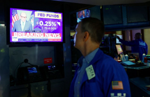 A NYSE trader looks at a screen after the Federal Reserve raised interest rates on Wednesday, in New York City, U.S. September 16, 2026. REUTERS/Jeenah Moon